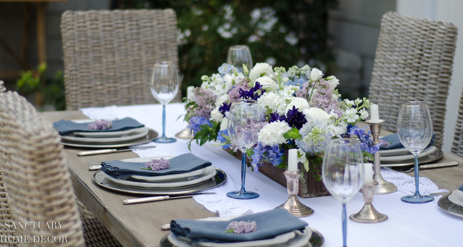 https://sanctuaryhomedecor.com/wp-content/uploads/2018/11/Rustic-Centerpiece-purple-flowers-Outdoor-Party-4-2.jpg