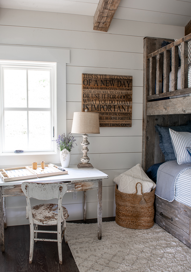 Kid's bunk room with shiplap walls and reclaimed wood bunk beds.