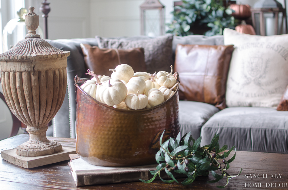 5 Minute Fall Decorating Tips-Copper bucket filled with mini white pumpkins.