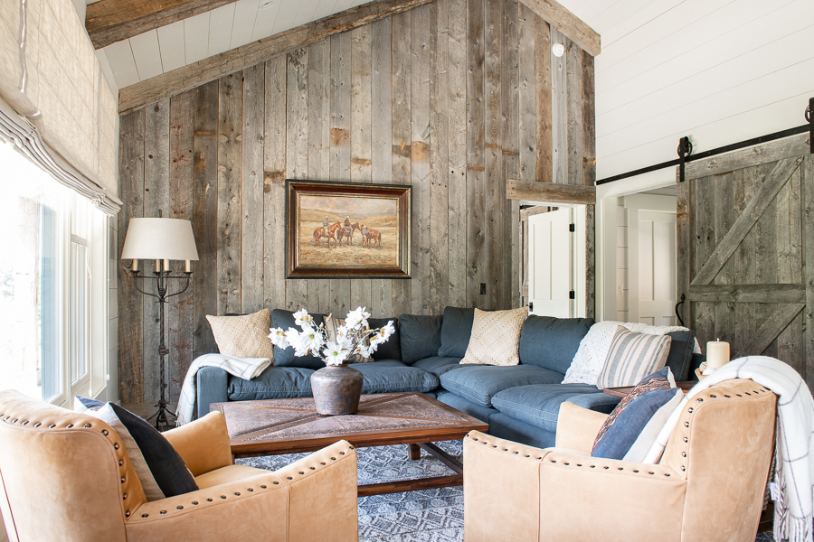 Small living room with shiplap, barn wood accent wall, barn door and fabric shades