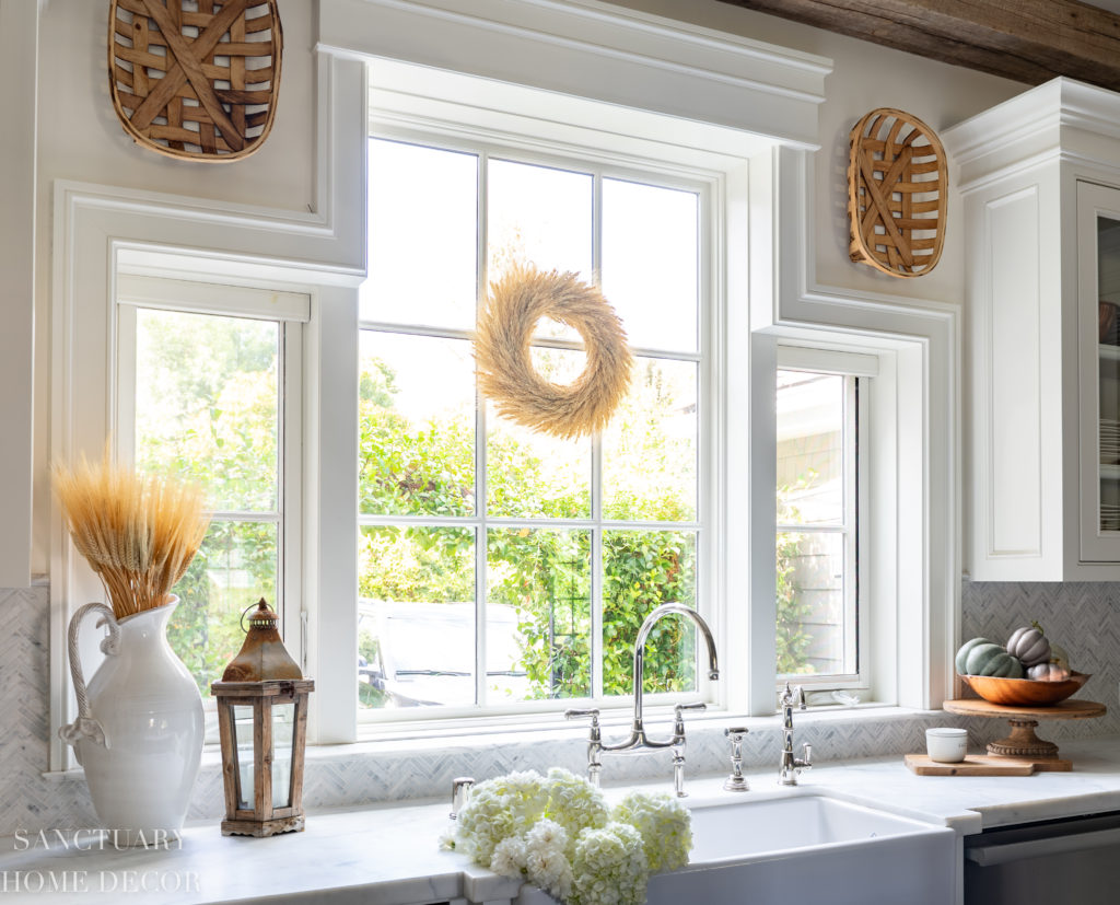 windows above large farmhouse kitchen sink